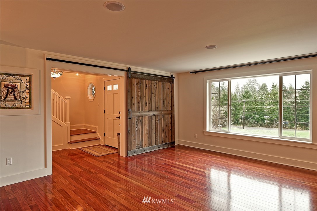 5918 Robe Menzel Road Snohomish, WA 98290 - Photo 19 of 40 a view of empty room with wooden floor and fan