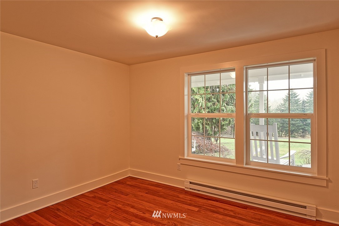 5918 Robe Menzel Road Snohomish, WA 98290 - Photo 35 of 40 an empty room with wooden floor and windows