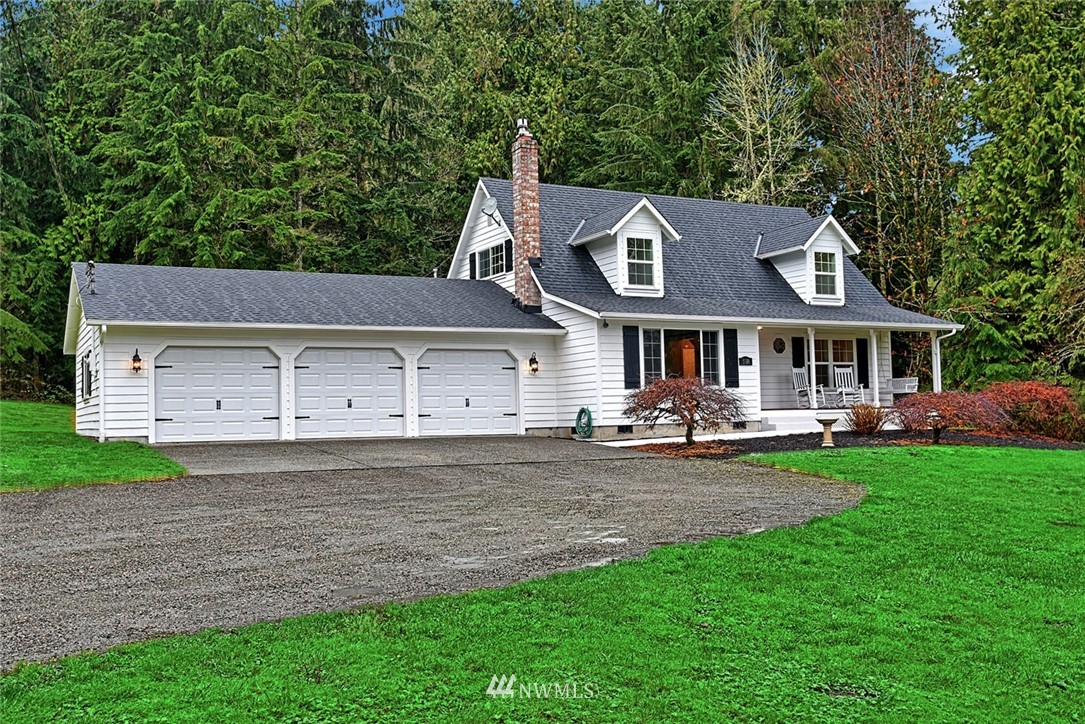 5918 Robe Menzel Road Snohomish, WA 98290 - Photo 38 of 40 a front view of a house with a garden and porch
