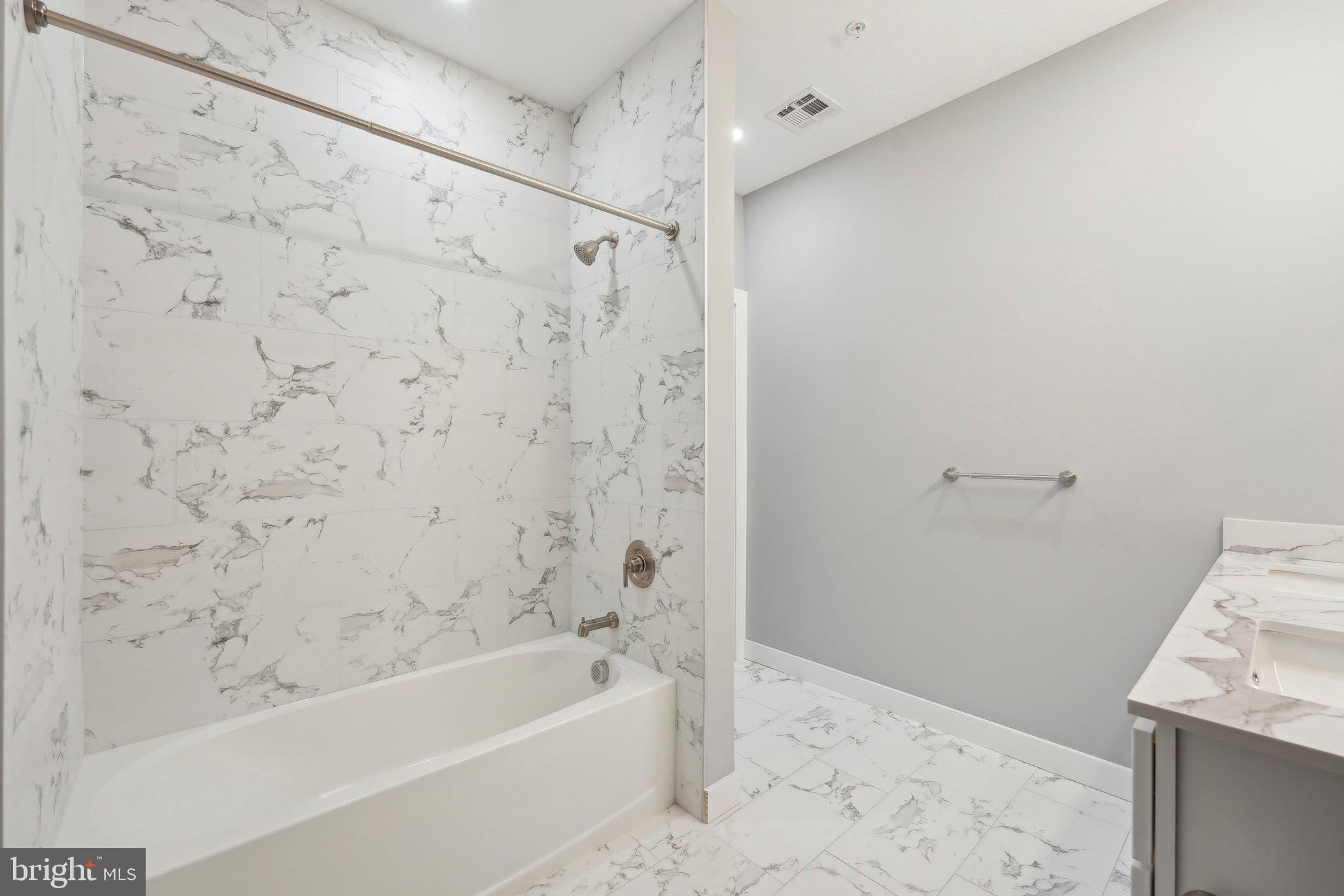 2421 Bristol Road, Unit 310 Warrington, PA 18976 - Photo 11 of 19 a bathroom with a bathtub and shower