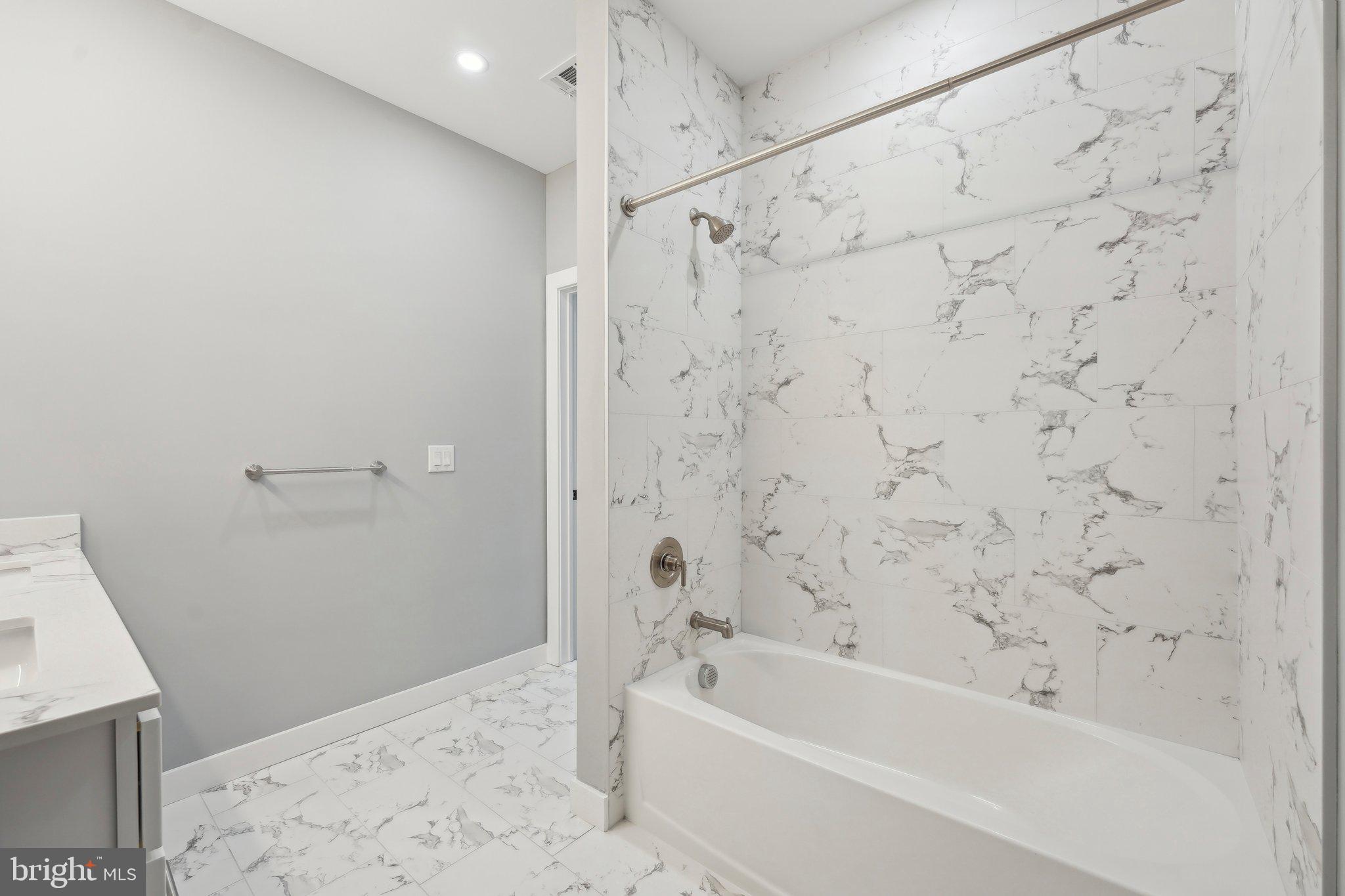 2421 Bristol Road, Unit 310 Warrington, PA 18976 - Photo 12 of 19 a bathroom with a bathtub and shower