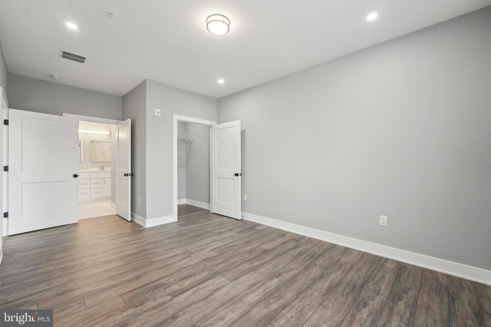 2421 Bristol Road, Unit 310 Warrington, PA 18976 - Photo 9 of 19 a view of an empty room with wooden floor