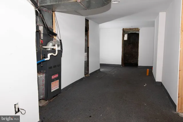 a view of a storage & utility room with closet