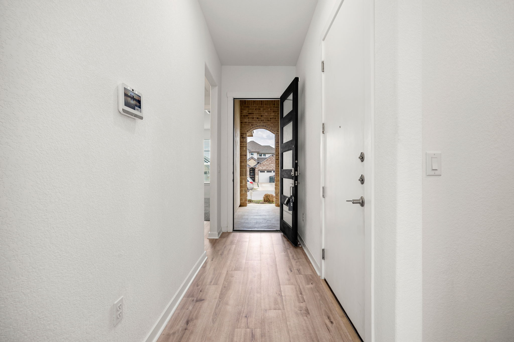 904 Balsora Cove Georgetown, TX 78628 - Photo 5 of 40 Hallway with 10 feet high ceiling and 8 feet high front door