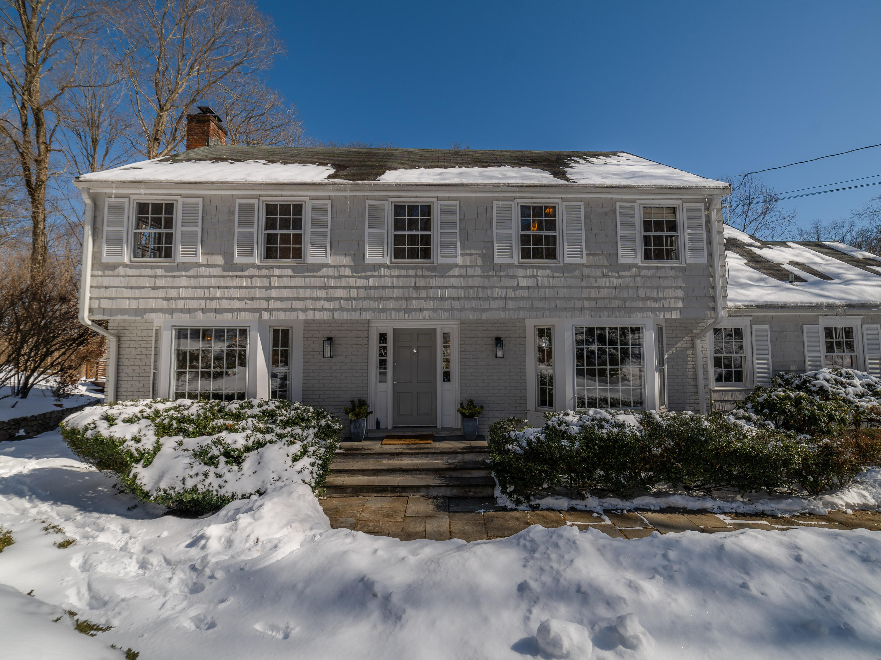 103 Salem Road New Canaan, CT 06840 - Photo 1 of 42 a front view of a house with a yard
