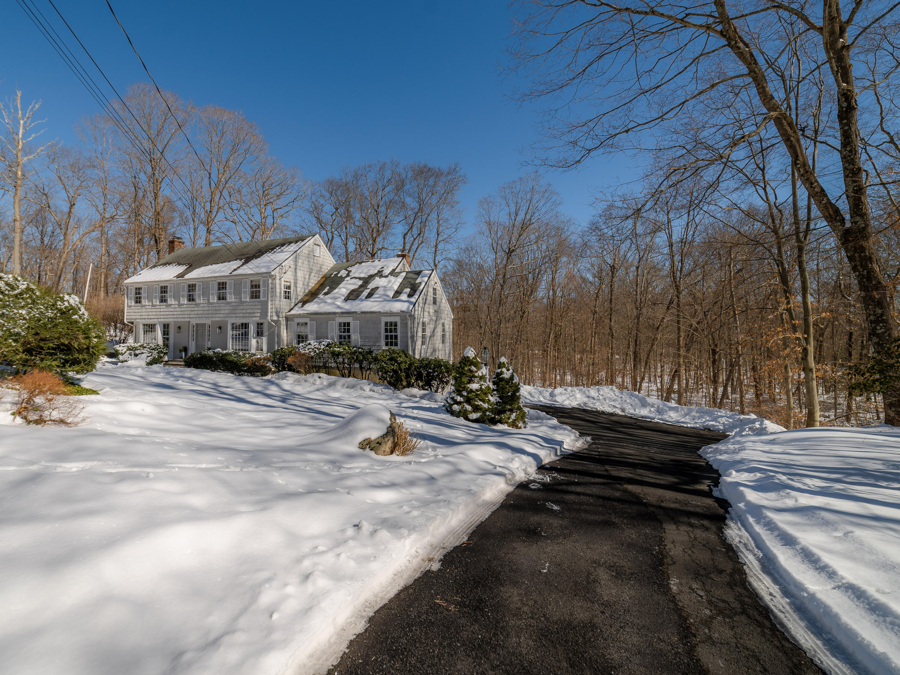 103 Salem Road New Canaan, CT 06840 - Photo 2 of 42 a view of a house with backyard and sitting area