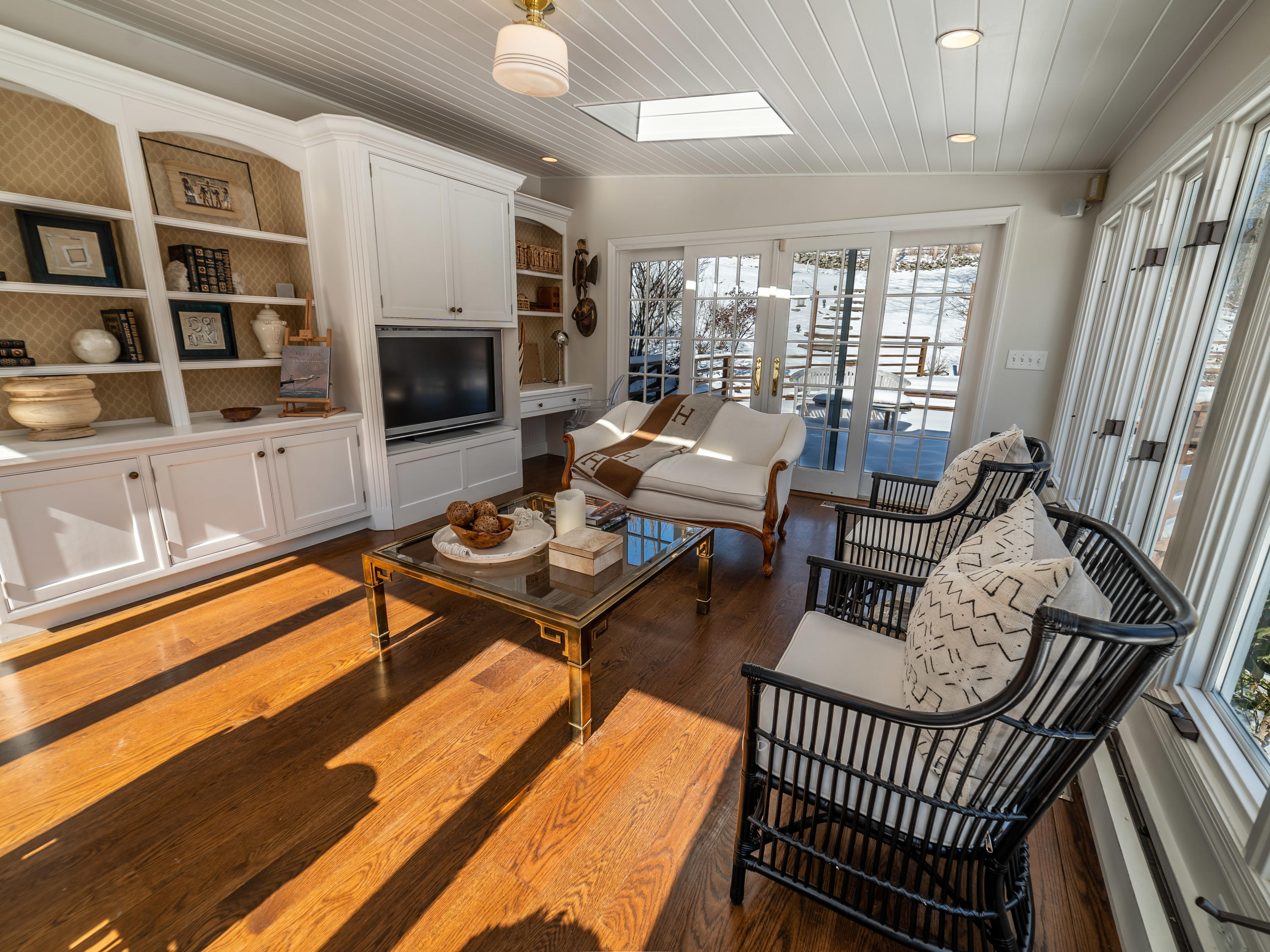 103 Salem Road New Canaan, CT 06840 - Photo 11 of 42 a living room with furniture a rug and a flat screen tv