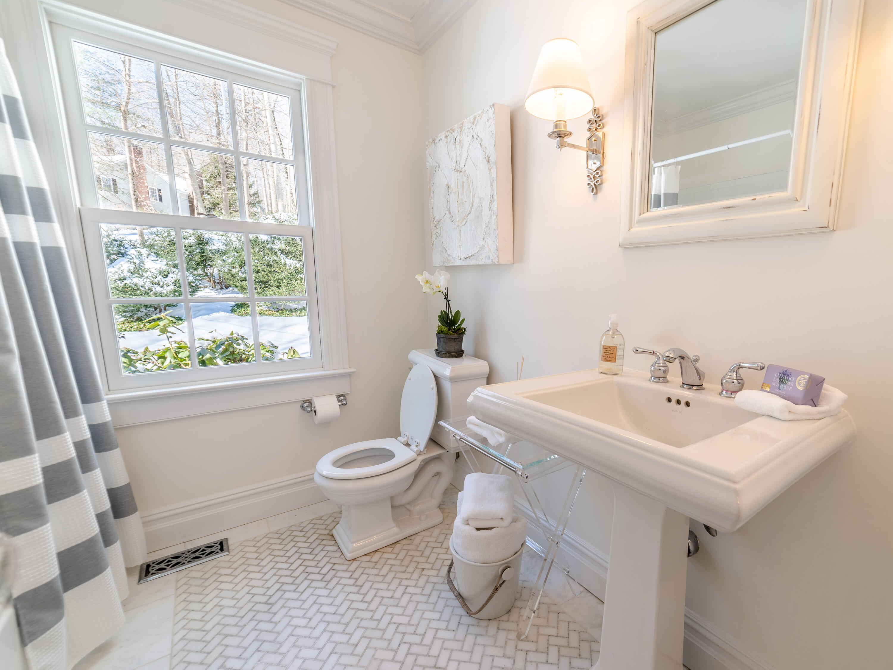 103 Salem Road New Canaan, CT 06840 - Photo 16 of 42 a bathroom with a sink toilet and a window