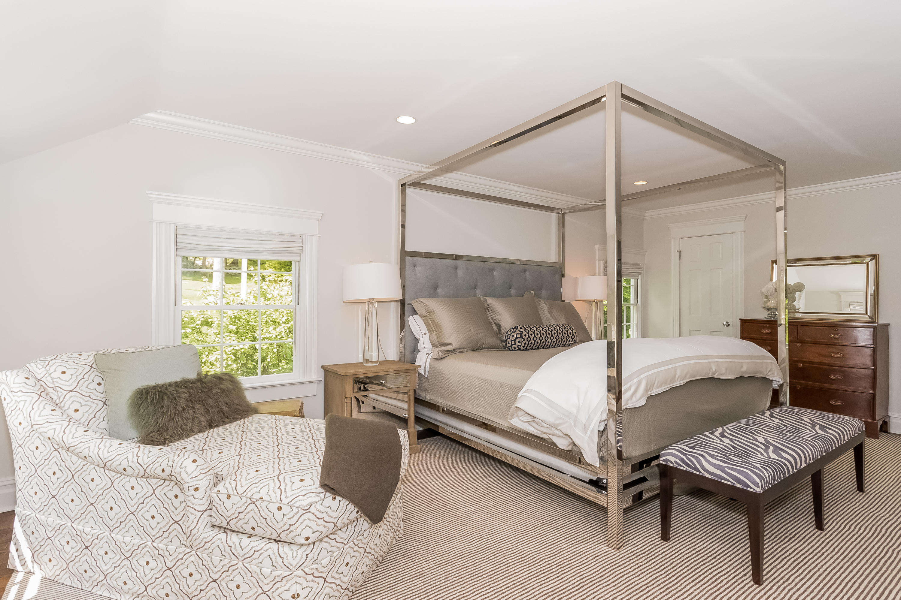 103 Salem Road New Canaan, CT 06840 - Photo 19 of 42 a bedroom with a bed and a chandelier