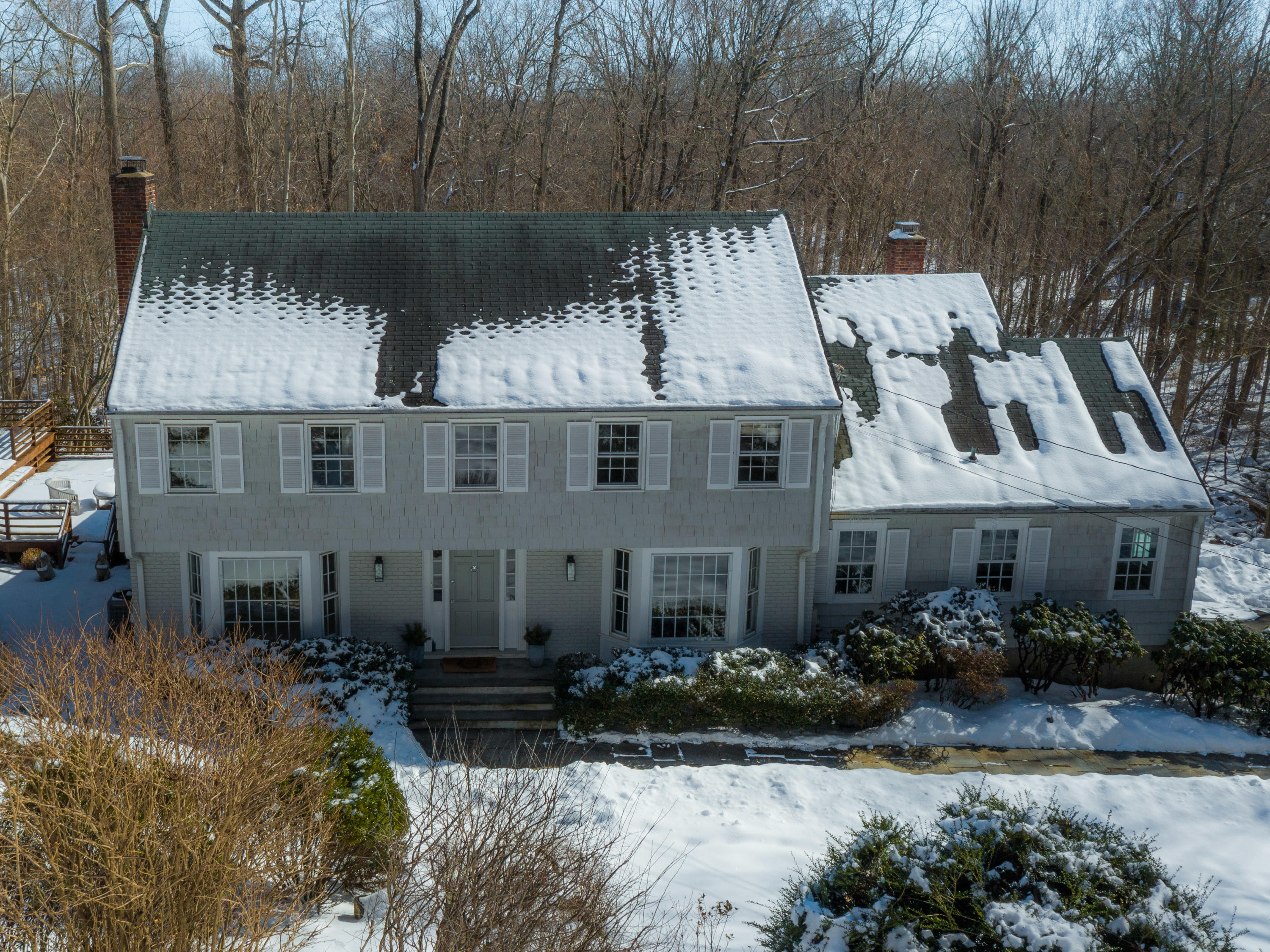 103 Salem Road New Canaan, CT 06840 - Photo 3 of 42 a front view of a house with garden
