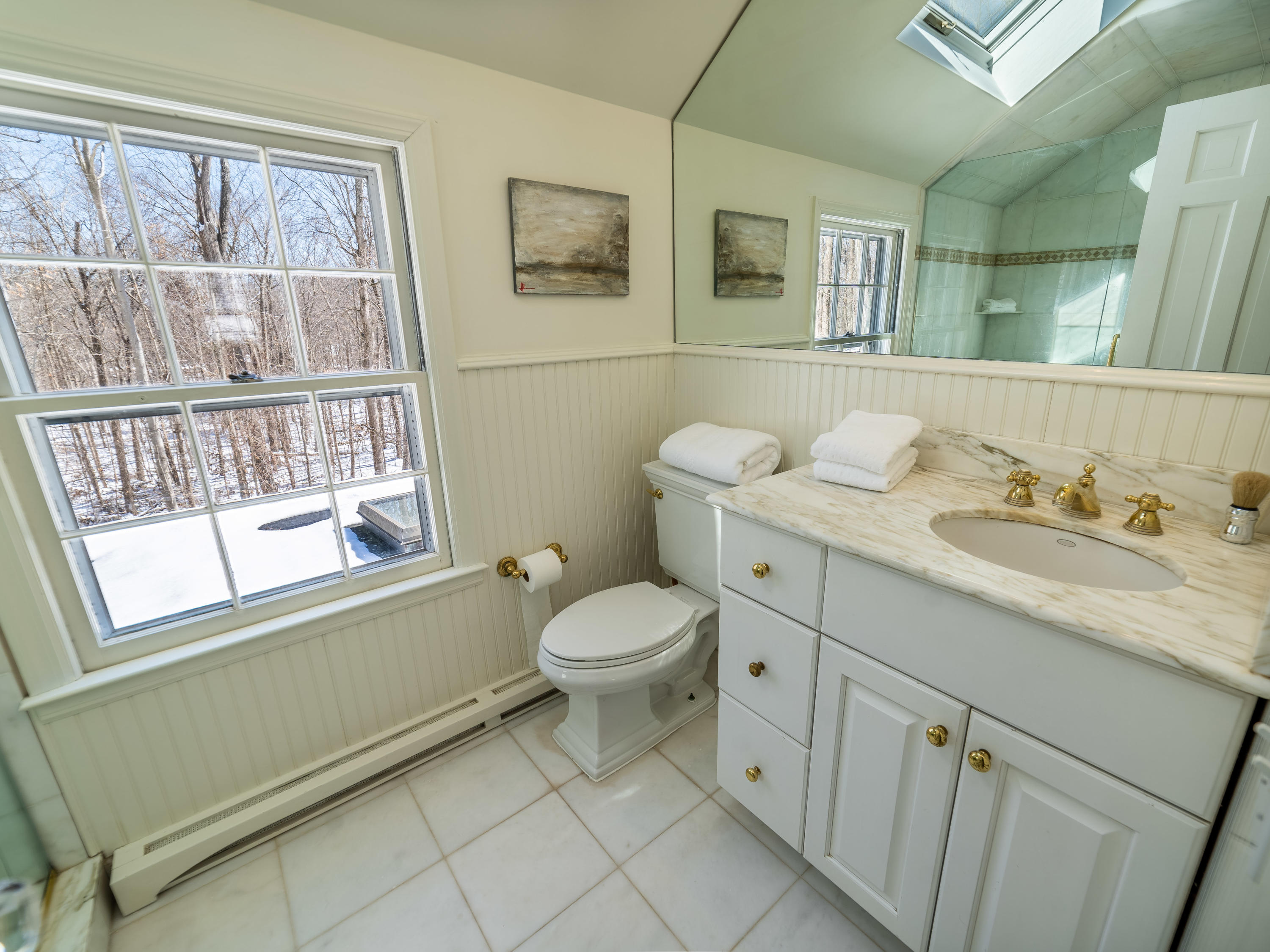 103 Salem Road New Canaan, CT 06840 - Photo 21 of 42 a bathroom with a granite countertop toilet sink and a window