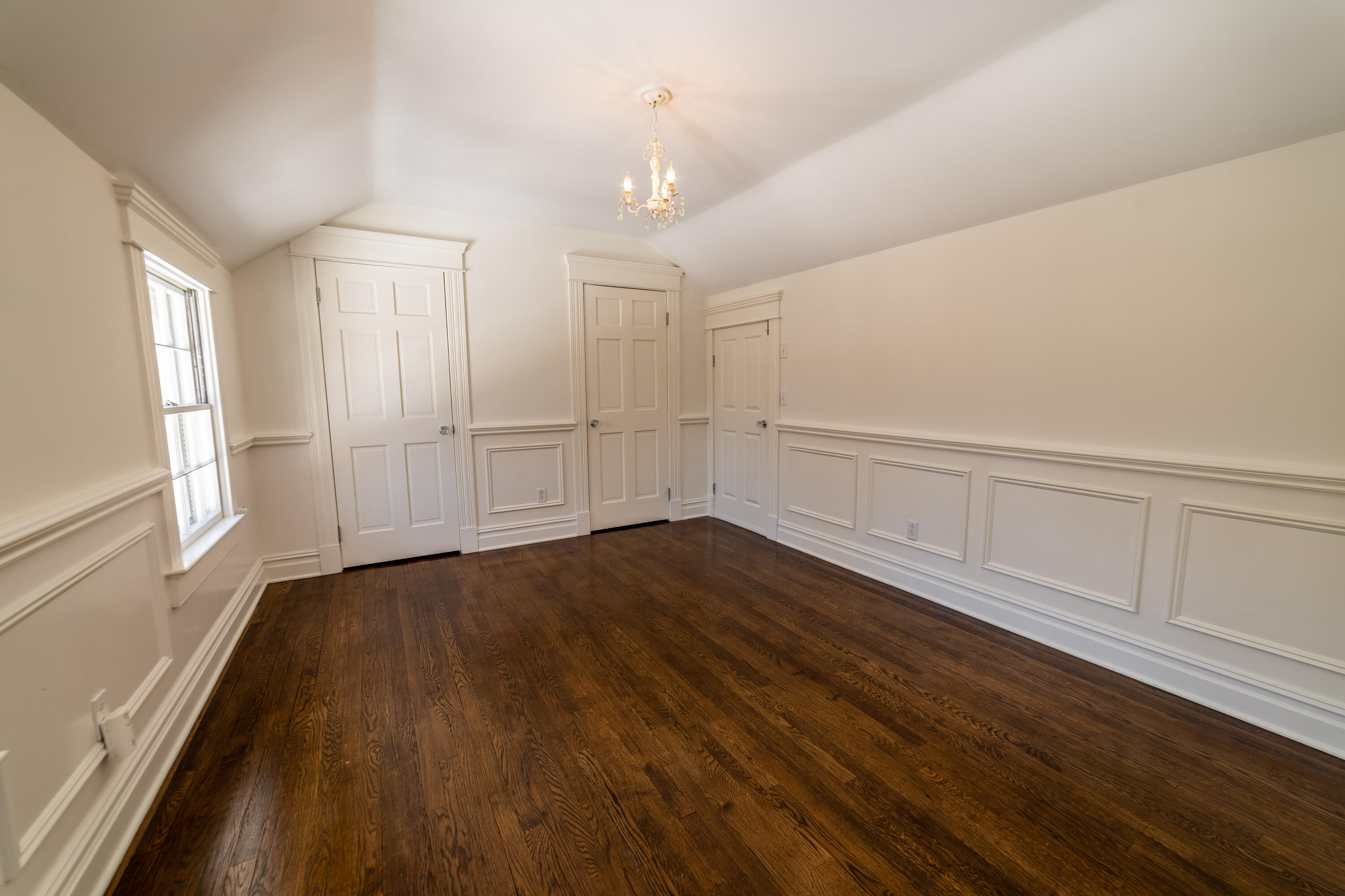 103 Salem Road New Canaan, CT 06840 - Photo 25 of 42 a view of an empty room with wooden floor and a window