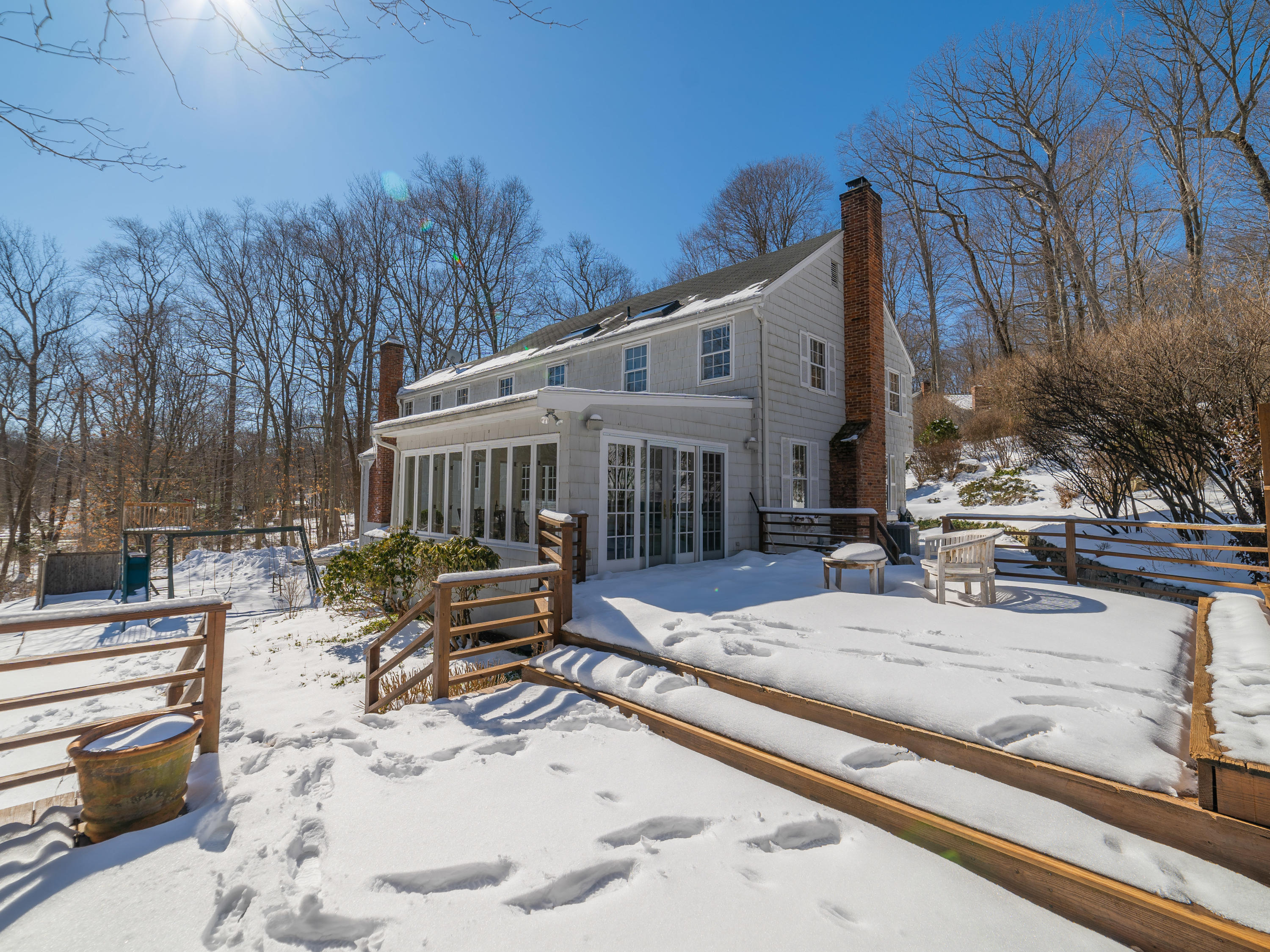 103 Salem Road New Canaan, CT 06840 - Photo 29 of 42 a view of a house with backyard outdoor seating and sitting area