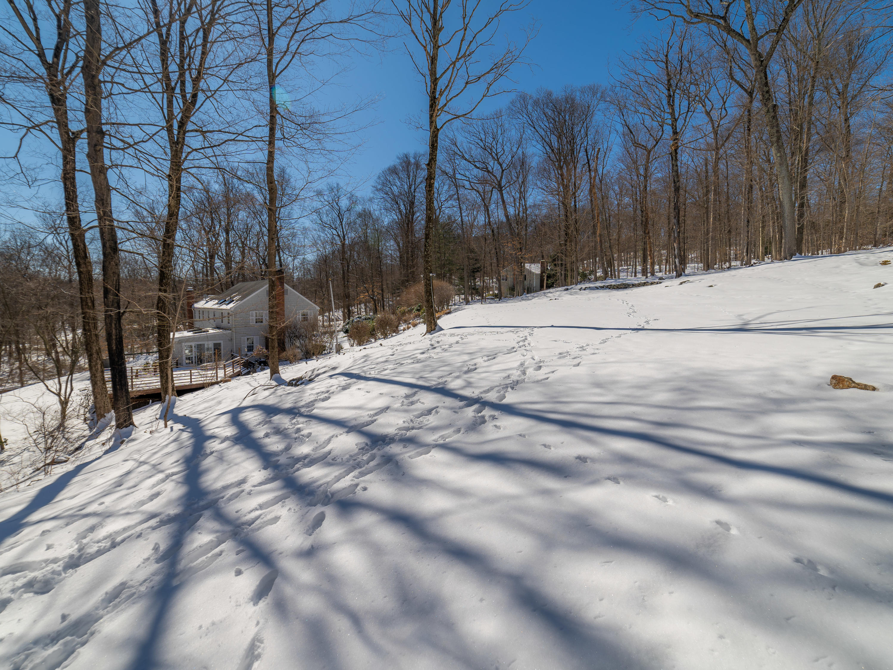 103 Salem Road New Canaan, CT 06840 - Photo 34 of 42 a view of snow on the side of a road