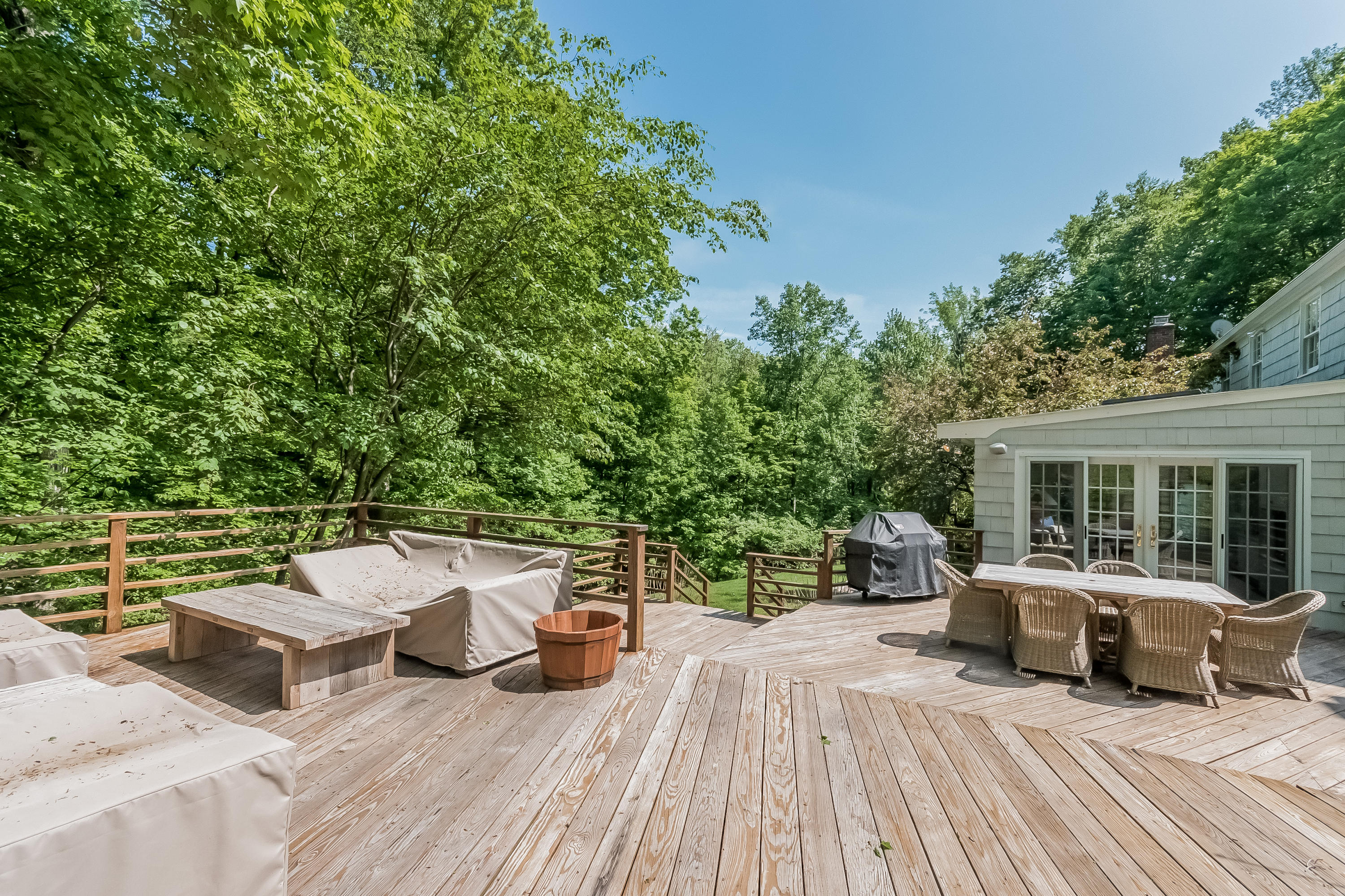 103 Salem Road New Canaan, CT 06840 - Photo 36 of 42 a view of a patio with couches table and chairs and potted plants
