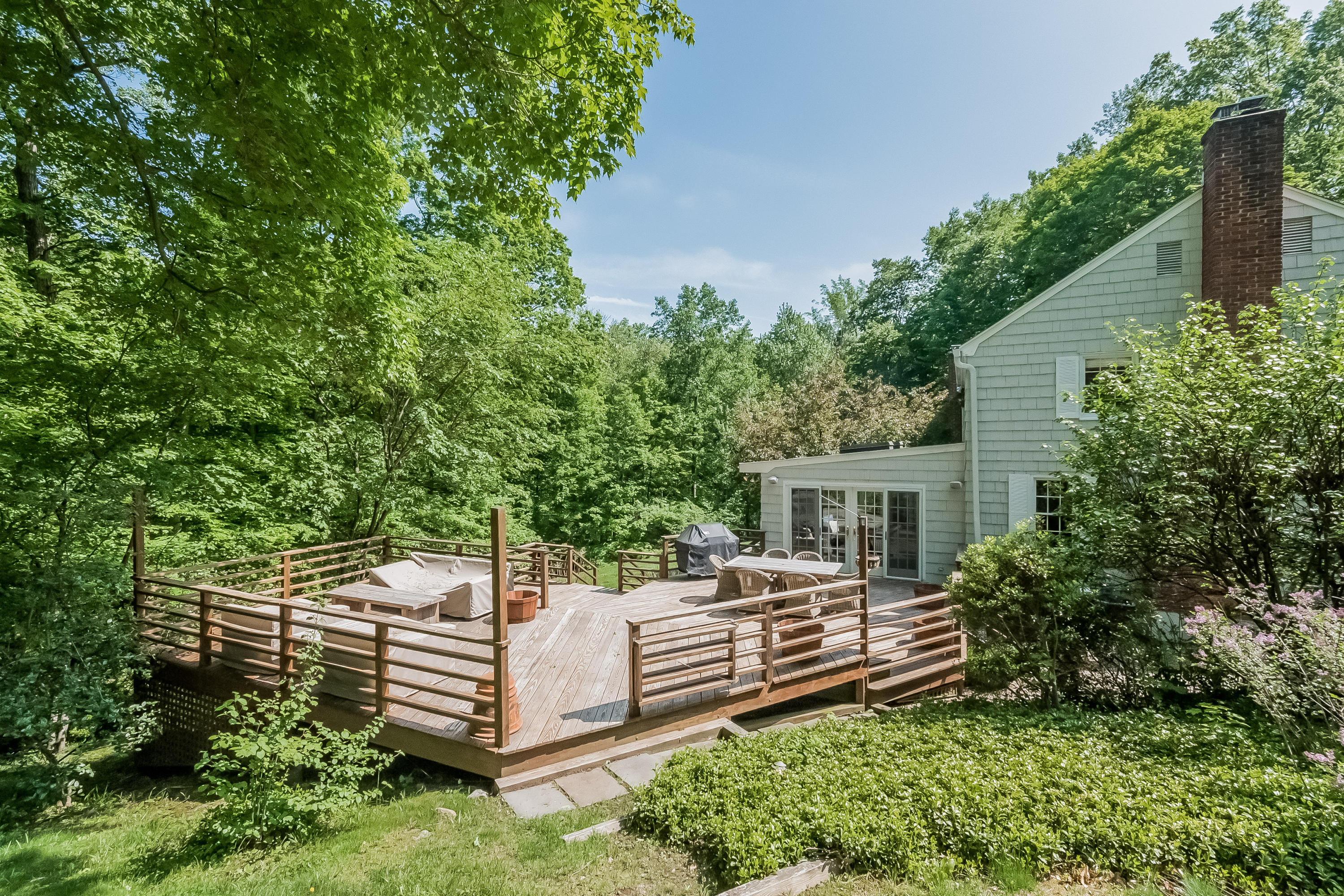 103 Salem Road New Canaan, CT 06840 - Photo 37 of 42 a view of a house with a yard
