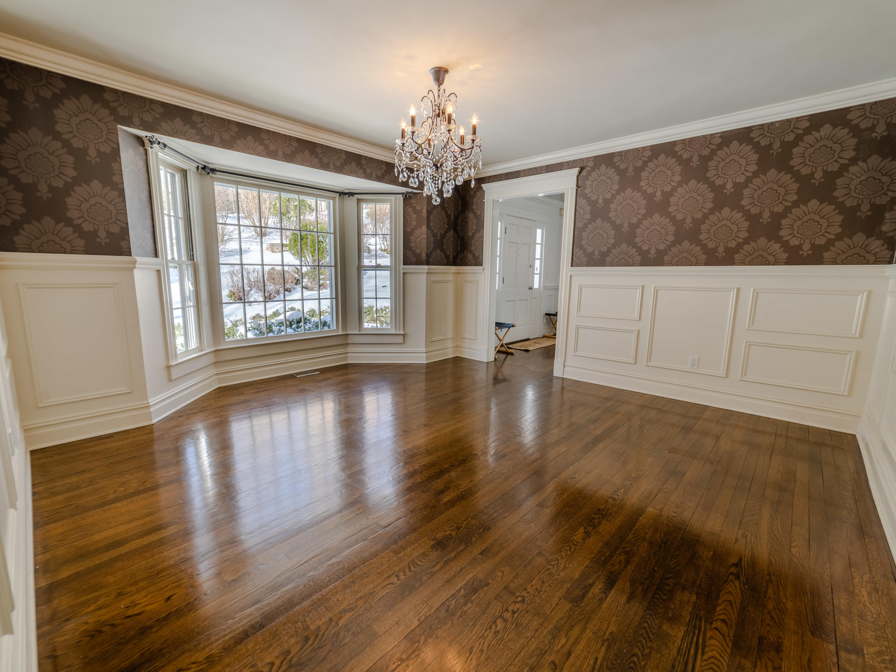 103 Salem Road New Canaan, CT 06840 - Photo 9 of 42 a view of an empty room with wooden floor and a window