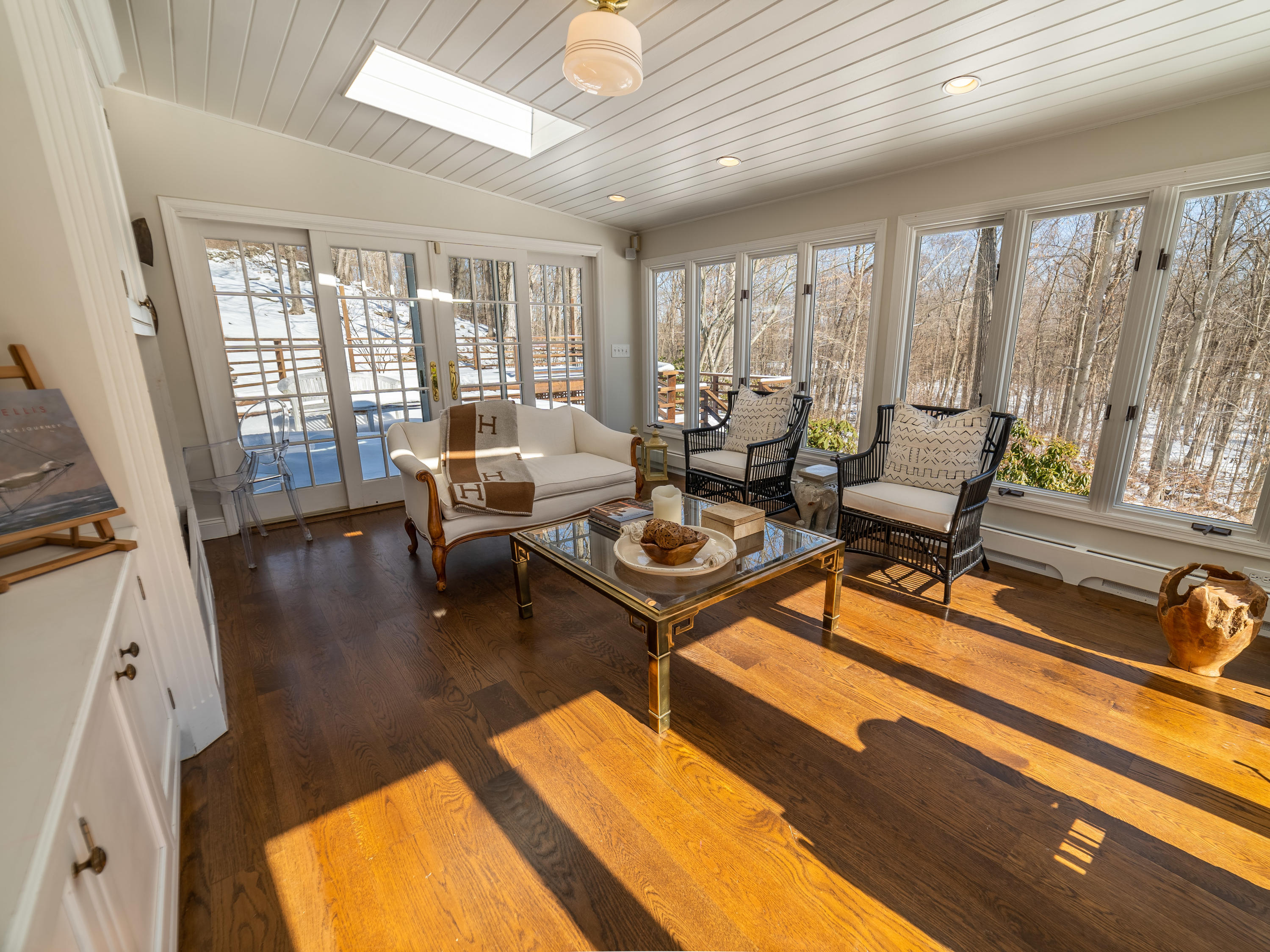103 Salem Road New Canaan, CT 06840 - Photo 10 of 42 a living room with furniture and large windows