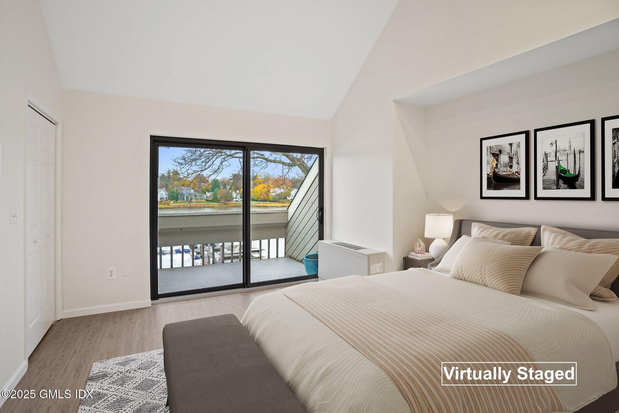7 River Road, Unit 310 Cos Cob, CT 06807 - Photo 13 of 19 a bedroom with a bed and a large window