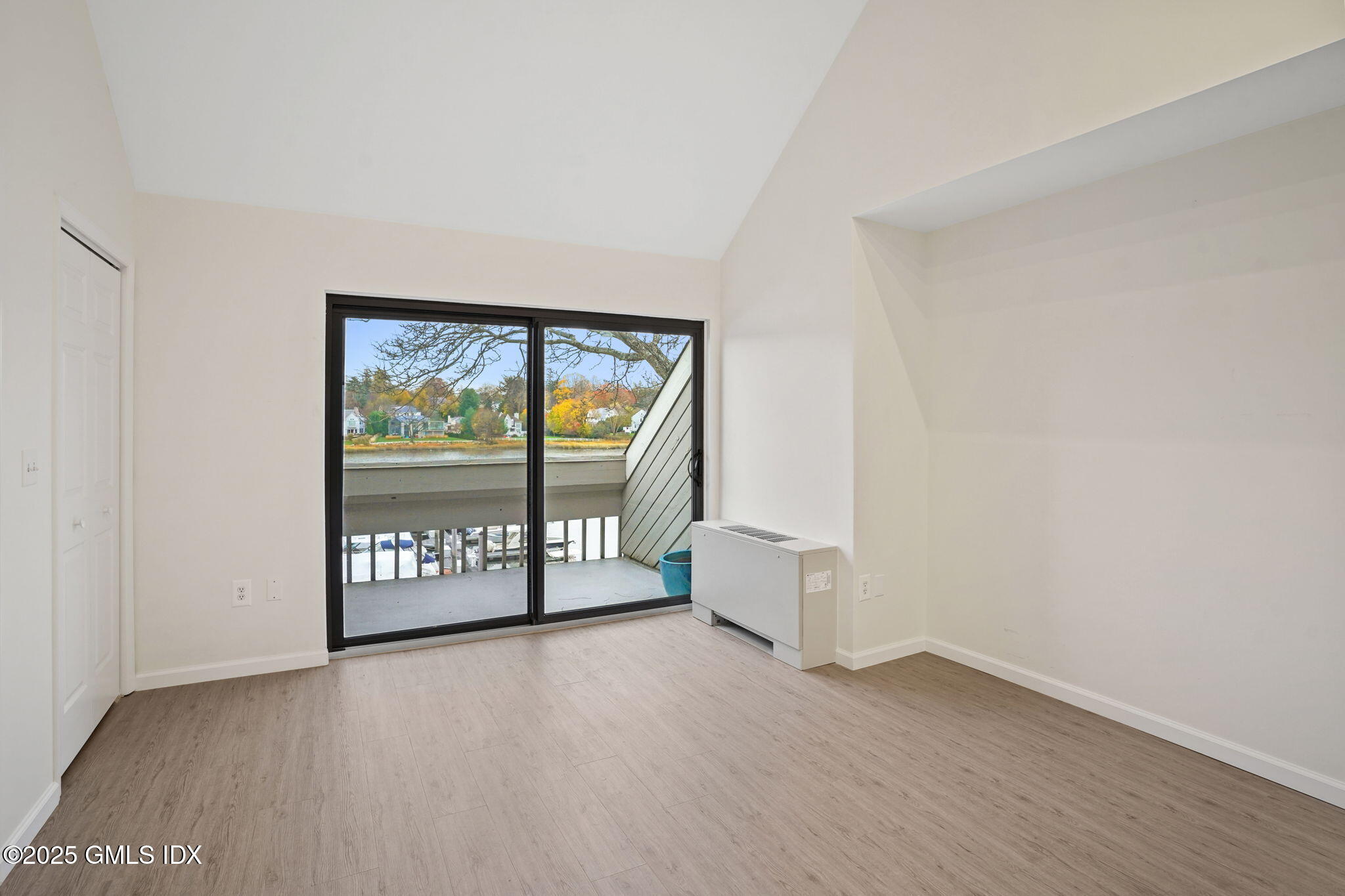 7 River Road, Unit 310 Cos Cob, CT 06807 - Photo 14 of 19 wooden floor in an empty room with a window
