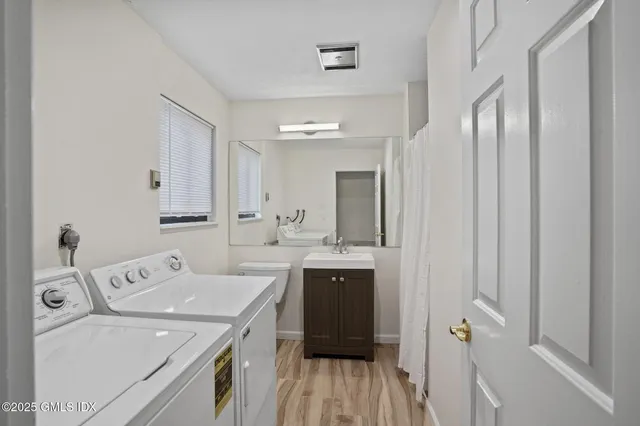 a view of a bathroom with a sink and mirror