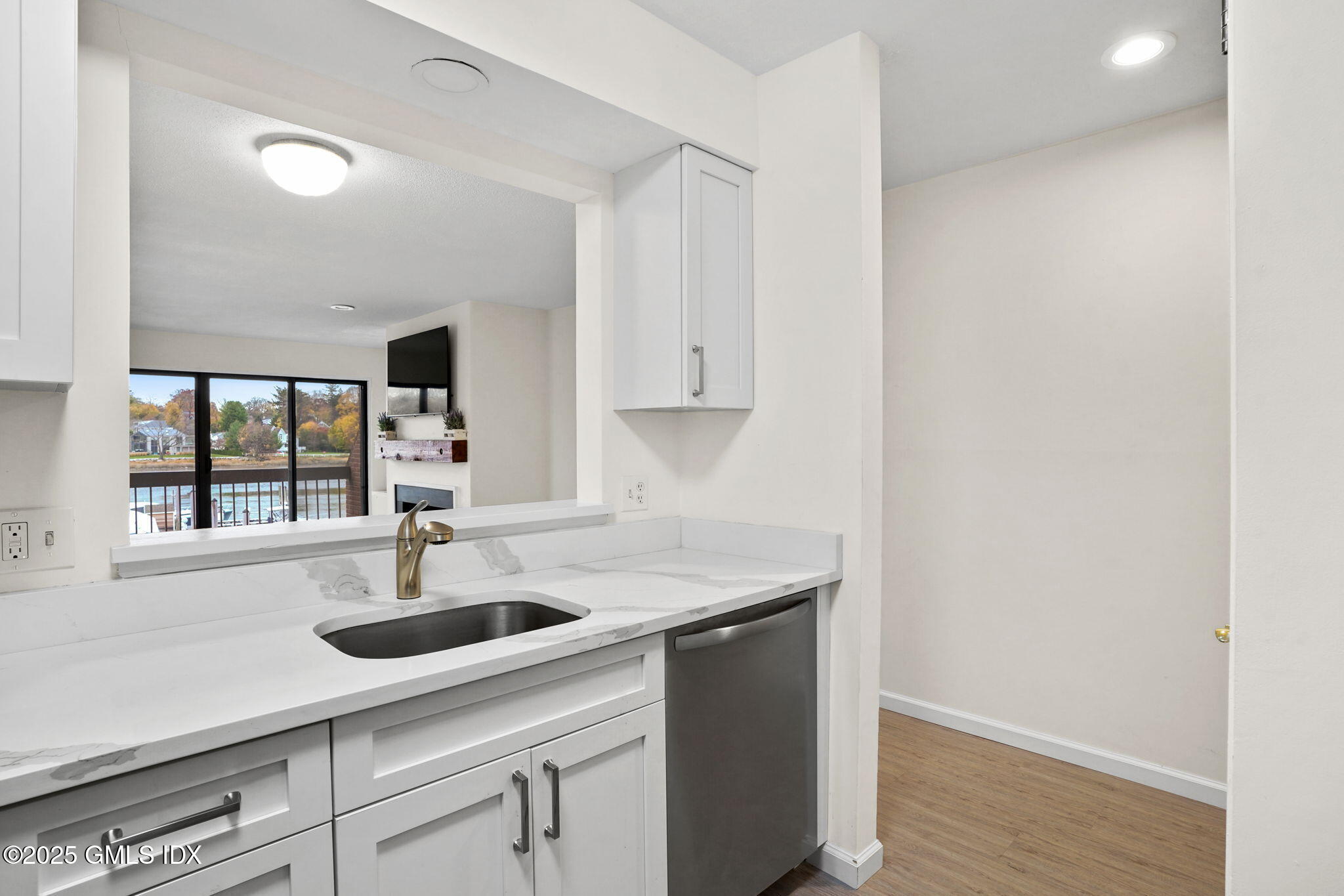 7 River Road, Unit 310 Cos Cob, CT 06807 - Photo 5 of 19 a kitchen with a sink and window