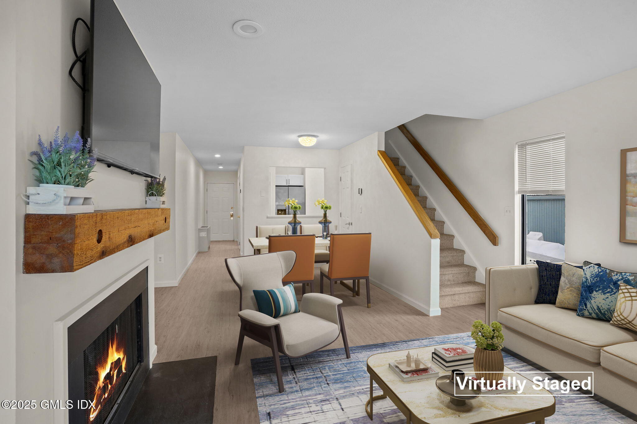 7 River Road, Unit 310 Cos Cob, CT 06807 - Photo 7 of 19 a living room with furniture and a fireplace