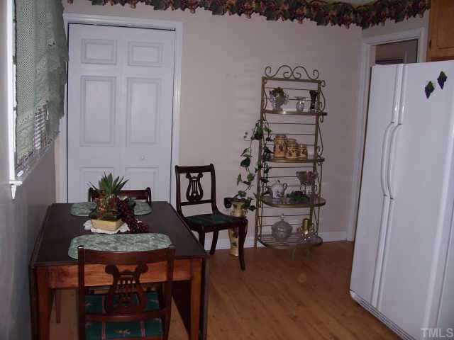 6503 Whitt Road Durham, NC 27712 - Photo 4 of 10 a table with chairs and wooden floor
