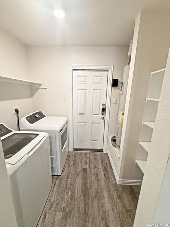 a view of storage and utility room with washer and dryer