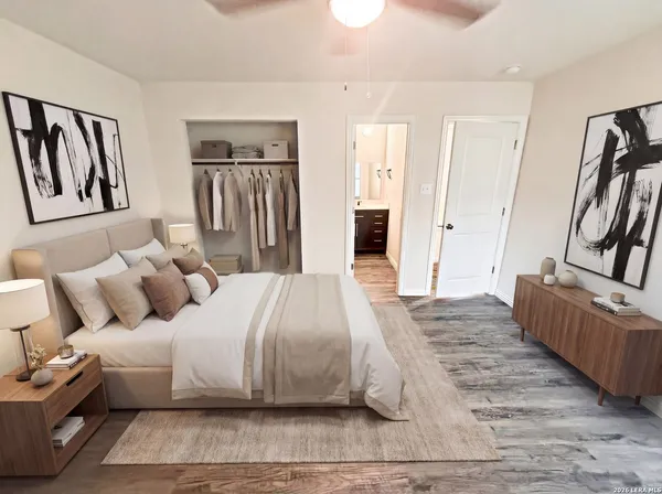 a bedroom with a large bed and furniture