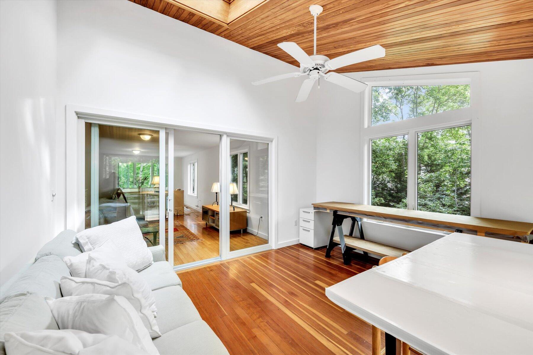 44 Nobska Road Woods Hole, MA 02543 - Photo 11 of 47 a bedroom with a bed and a large window with balcony view