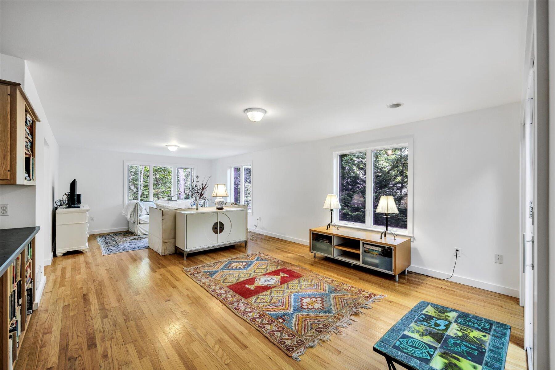 44 Nobska Road Woods Hole, MA 02543 - Photo 18 of 47 a living room with furniture and a wooden floor