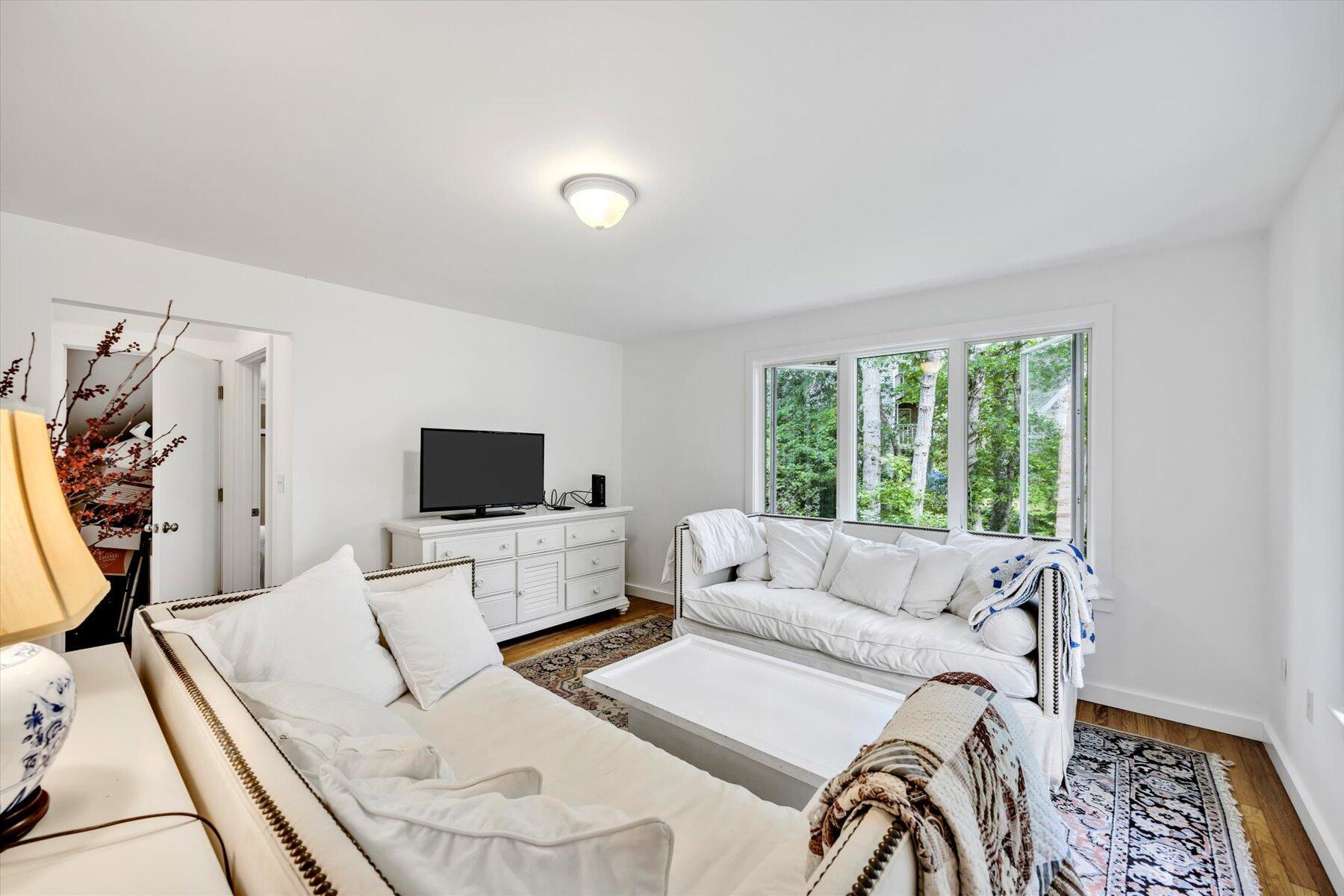 44 Nobska Road Woods Hole, MA 02543 - Photo 19 of 47 a living room with furniture and a flat screen tv