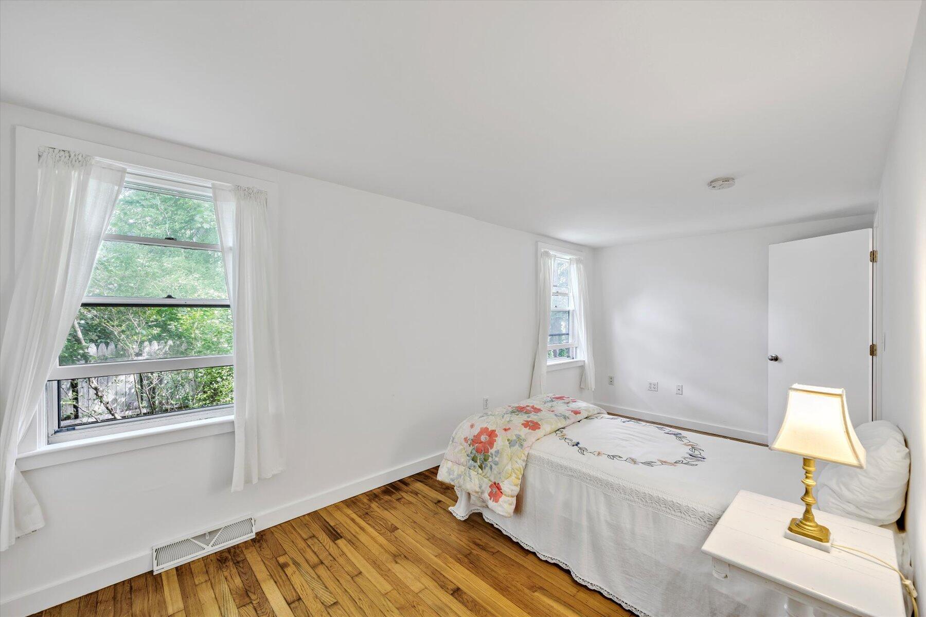 44 Nobska Road Woods Hole, MA 02543 - Photo 22 of 47 a bedroom with a bed and a window