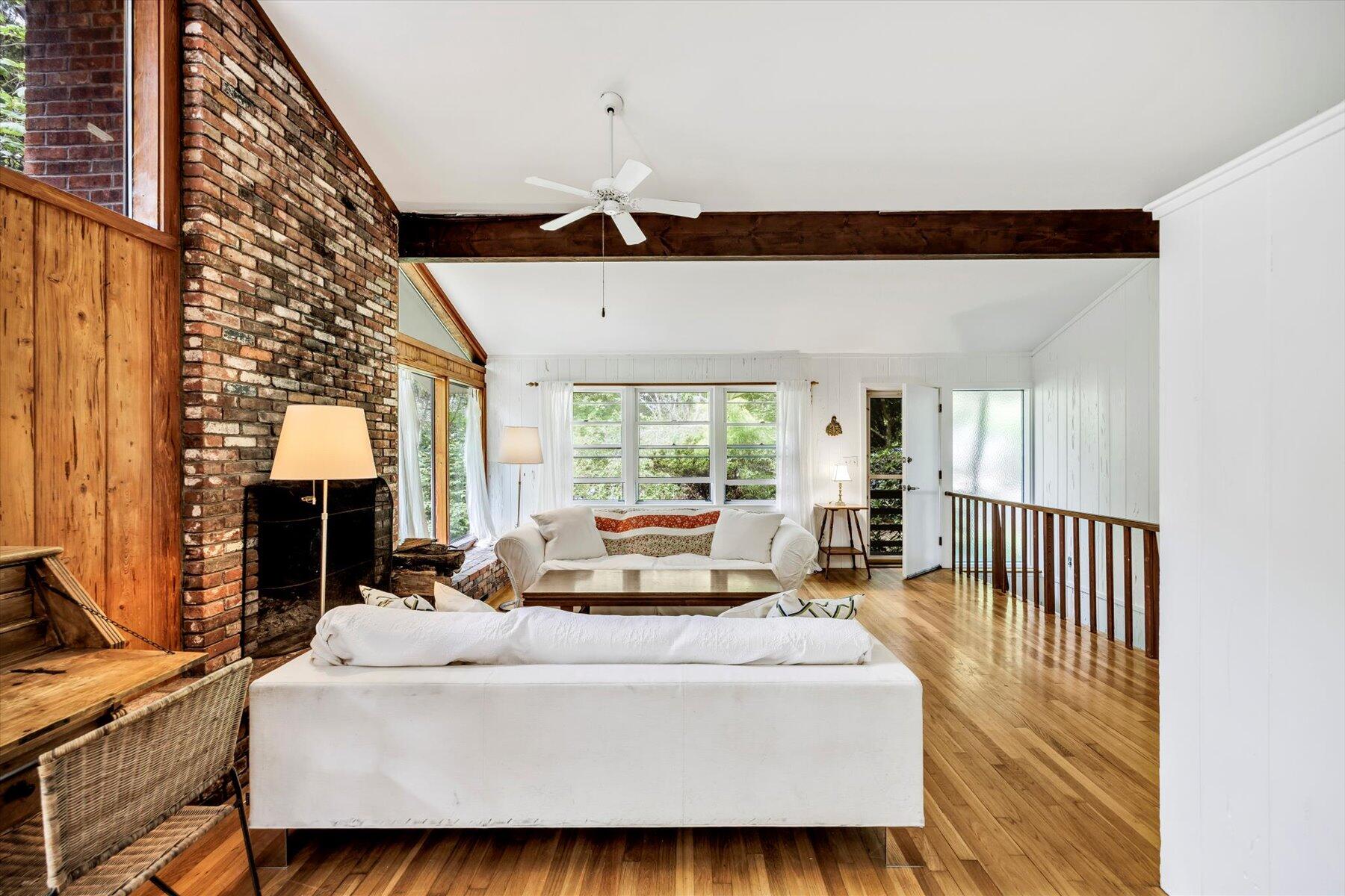 44 Nobska Road Woods Hole, MA 02543 - Photo 29 of 47 a bedroom with a bed a chandelier and large window