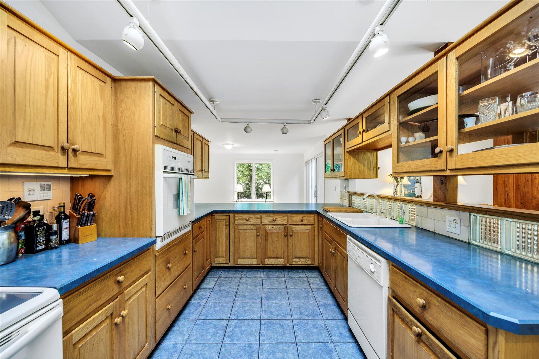 44 Nobska Road Woods Hole, MA 02543 - Photo 34 of 47 a kitchen with stainless steel appliances granite countertop a sink and cabinets