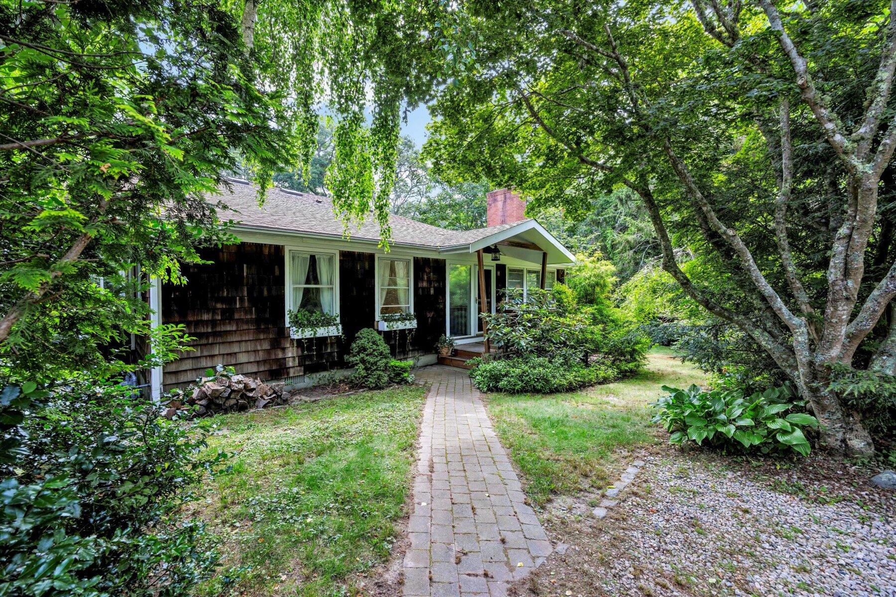44 Nobska Road Woods Hole, MA 02543 - Photo 38 of 47 a front view of a house with yard and green space
