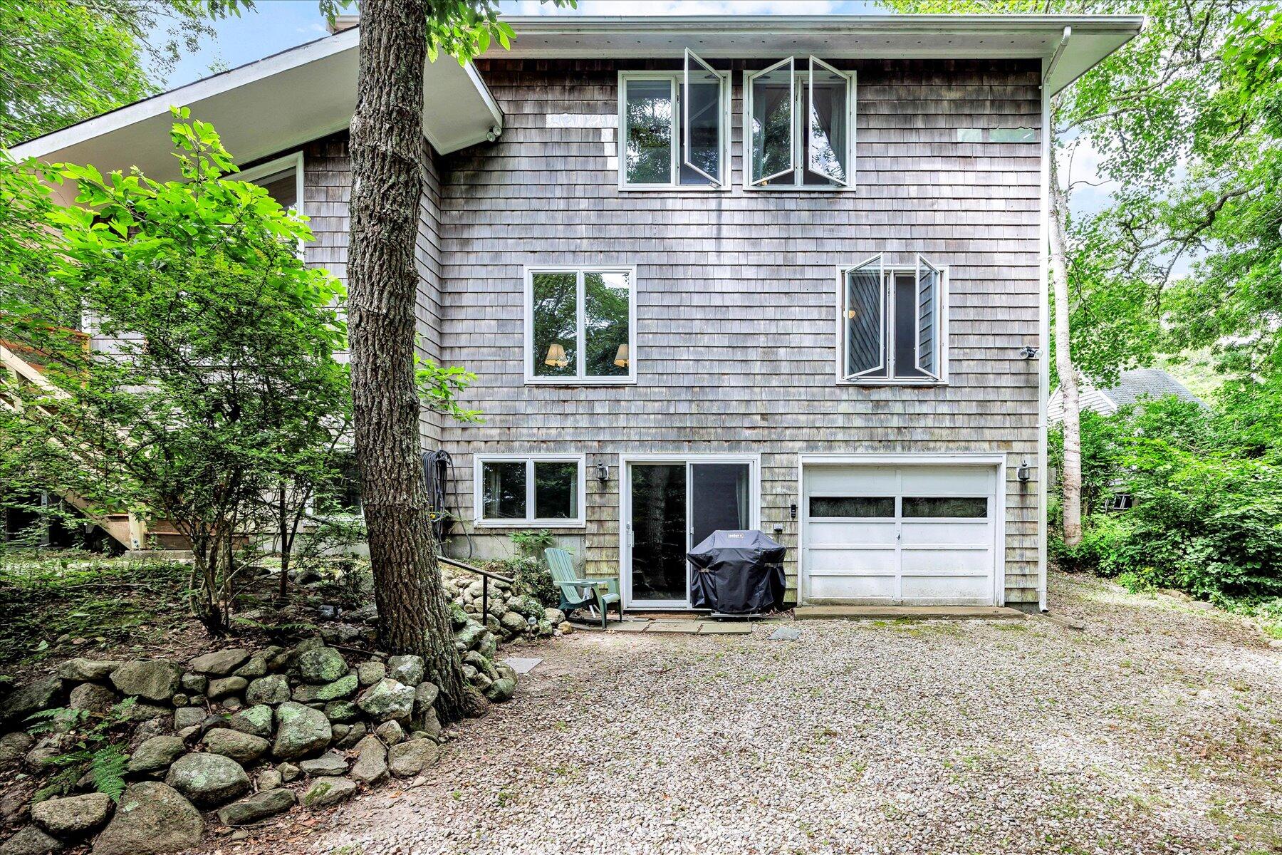 44 Nobska Road Woods Hole, MA 02543 - Photo 39 of 47 a front view of a house with a yard