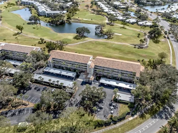 an aerial view of residential houses and outdoor space