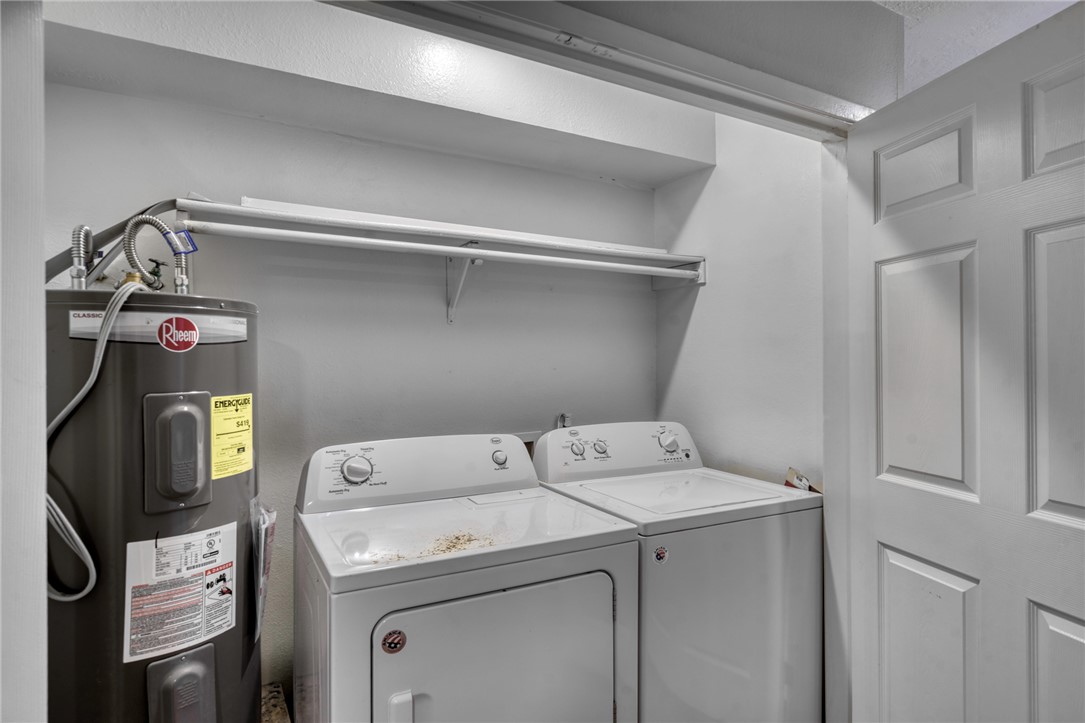 902 Spring Loop, Unit B College Station, TX 77840 - Photo 5 of 10 Laundry area with electric water heater and separate washer and dryer