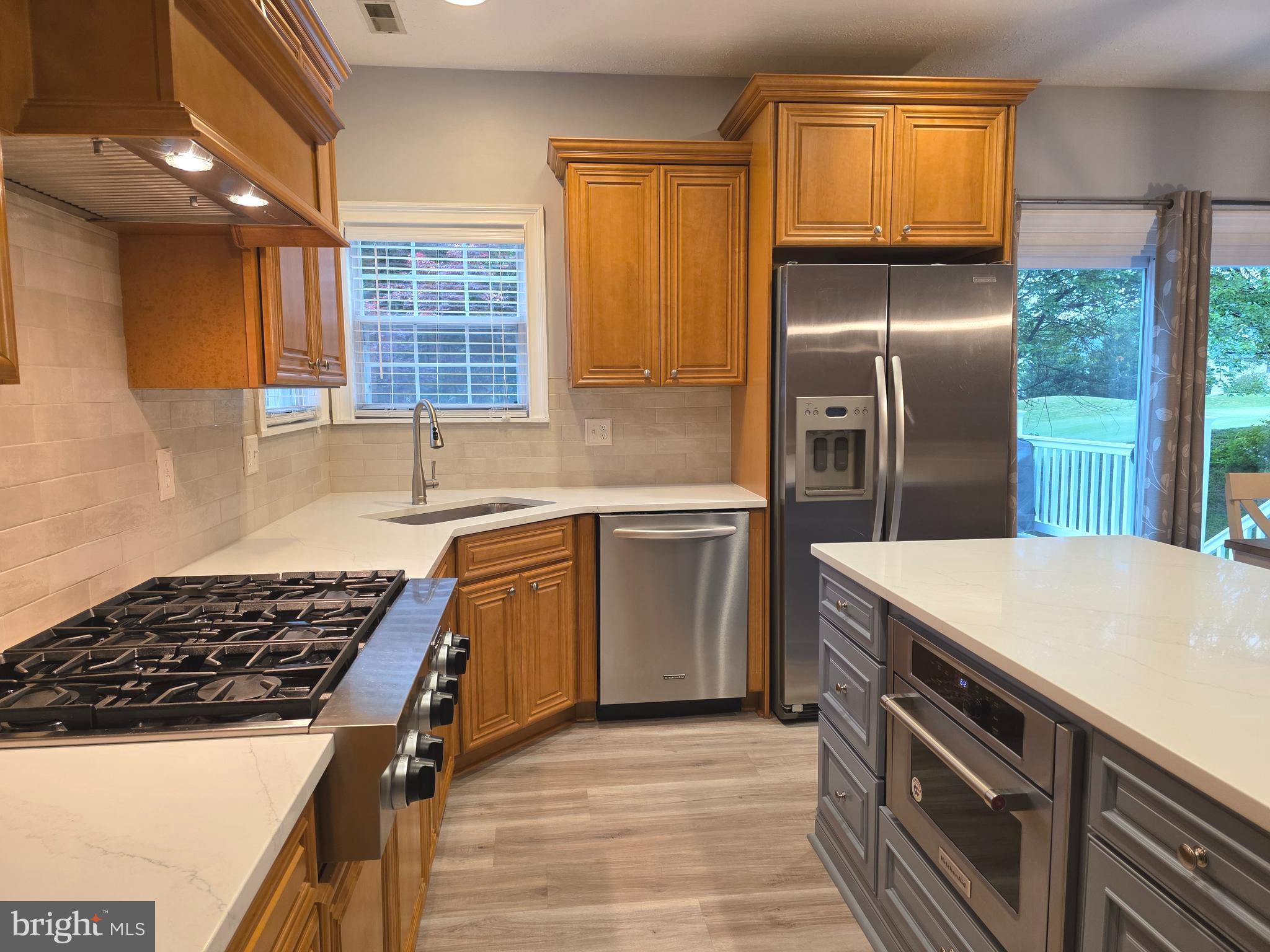 2441 Kemper Road Crofton, MD 21114 - Photo 15 of 63 a kitchen with a sink stove and refrigerator