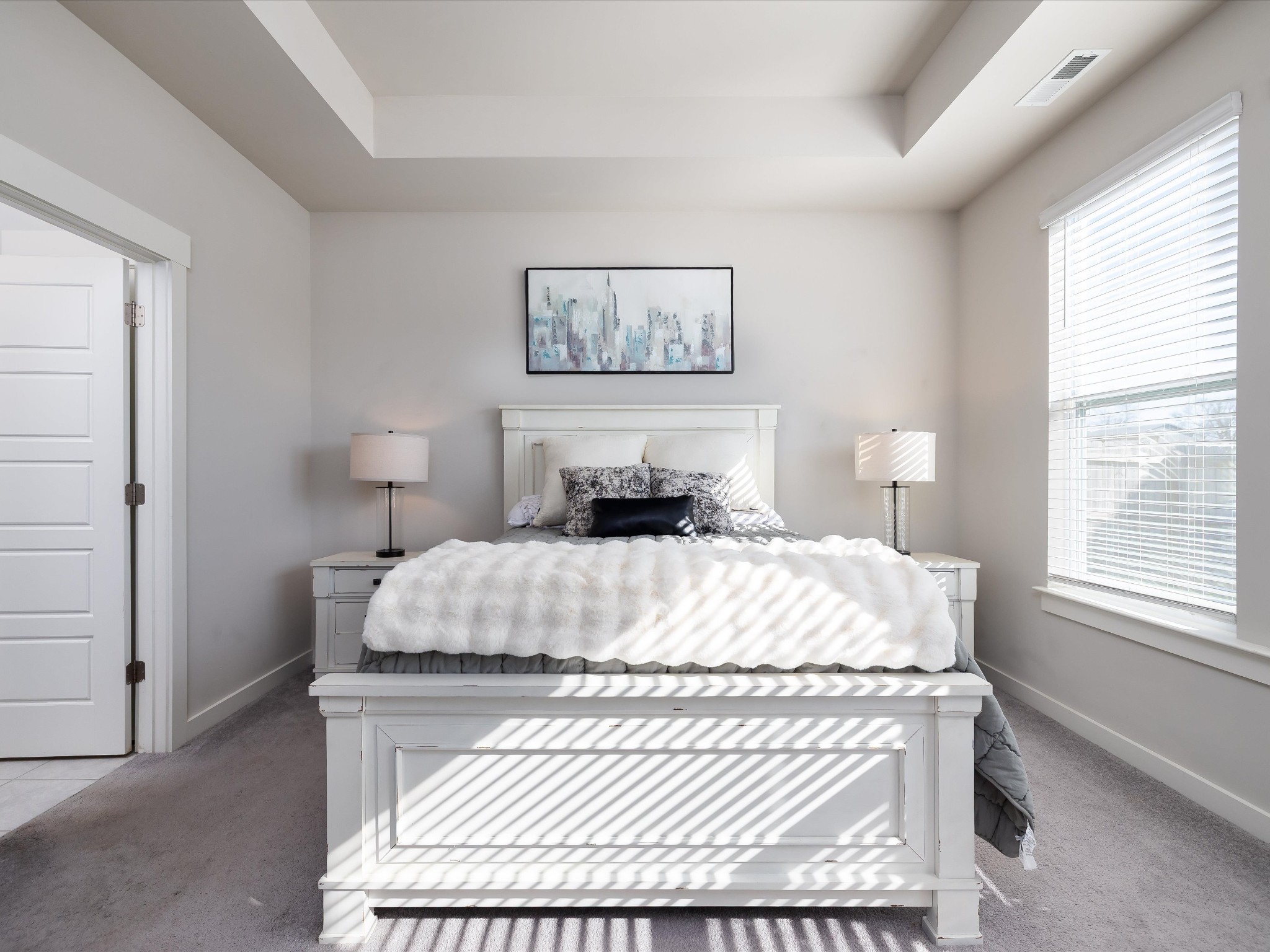 145 Southwind Run Spring Hill, TN 37174 - Photo 23 of 62 a bedroom with a bed and a painting on the wall