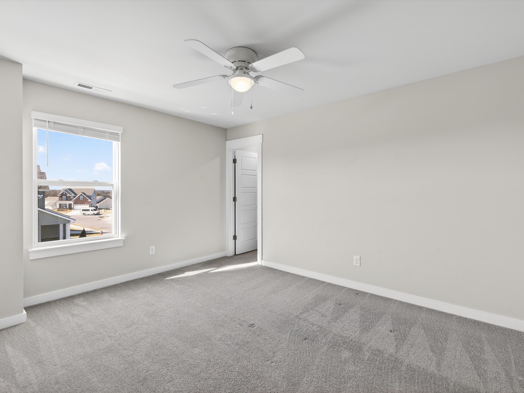 145 Southwind Run Spring Hill, TN 37174 - Photo 47 of 62 an empty room with a window and a fan