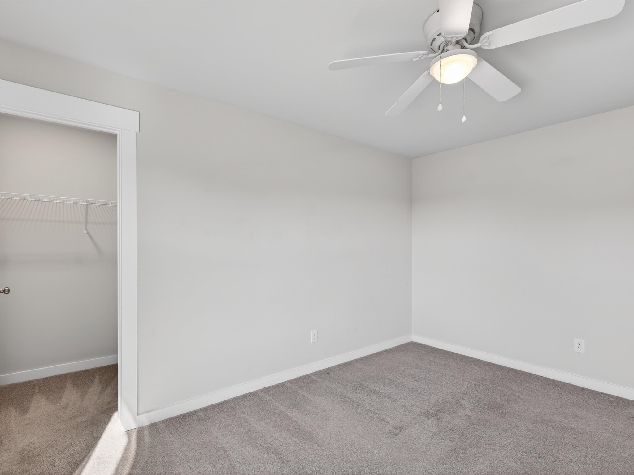 145 Southwind Run Spring Hill, TN 37174 - Photo 48 of 62 an empty room with a ceiling fan and a window