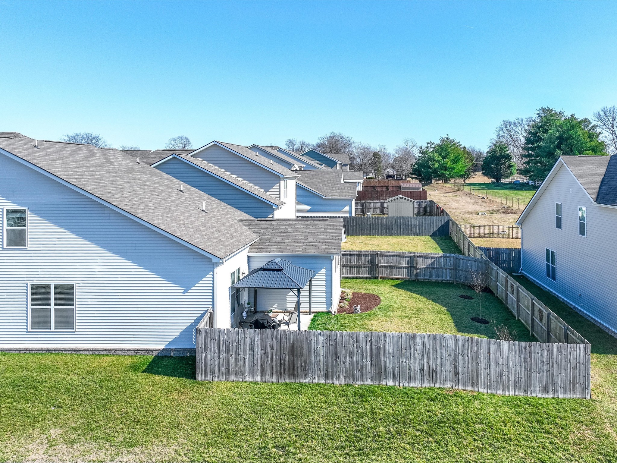 145 Southwind Run Spring Hill, TN 37174 - Photo 58 of 62 a front view of house with yard and outdoor seating