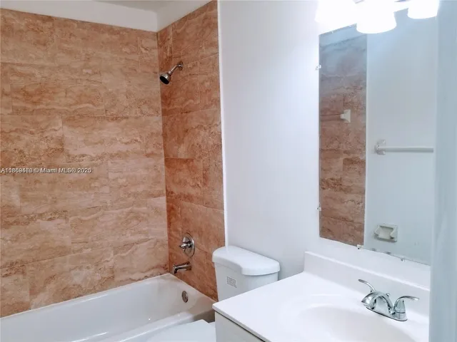 a bathroom with a bathtub and a sink