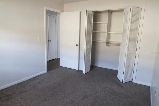 a view of empty room with closet area