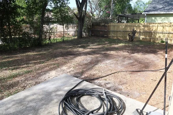 a backyard of a house with lots of green space