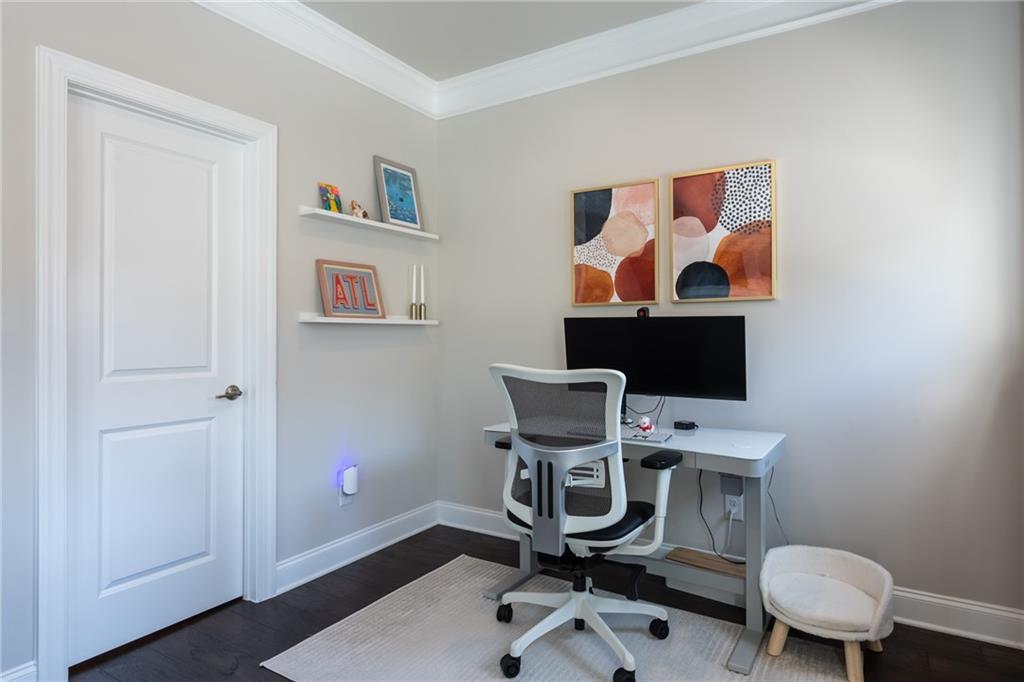 4062 Townsend Lane Atlanta, GA 30346 - Photo 22 of 52 a workspace with furniture and wooden floor