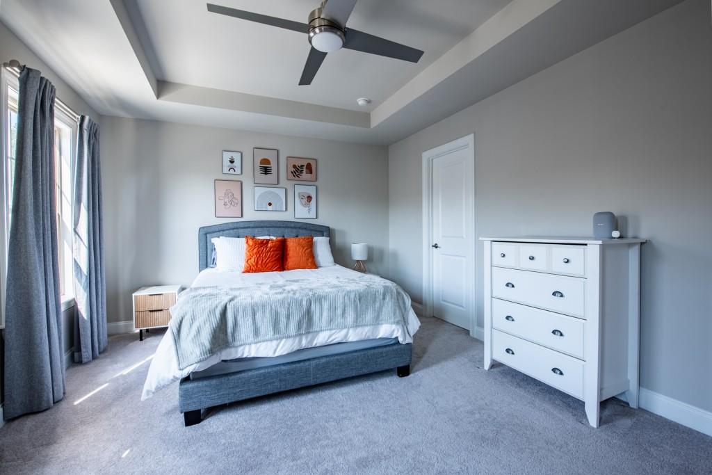 4062 Townsend Lane Atlanta, GA 30346 - Photo 29 of 52 a bedroom with a bed and a night stand